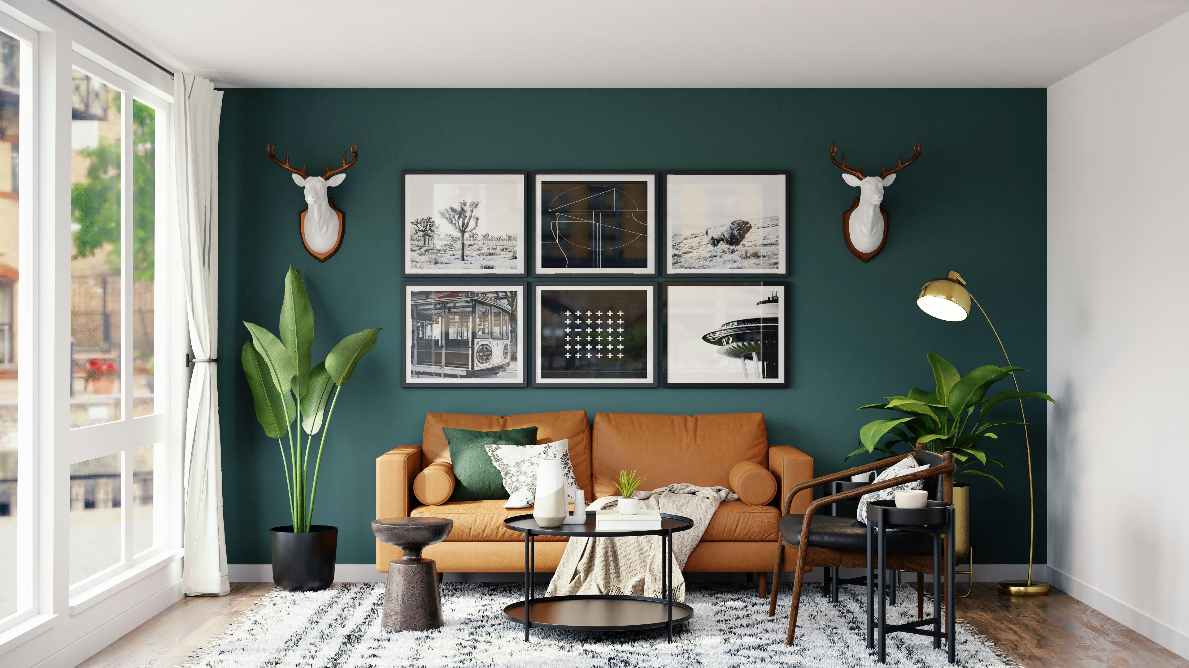 Stylish living room featuring a teal accent wall, brown sofa, and gallery wall of art.